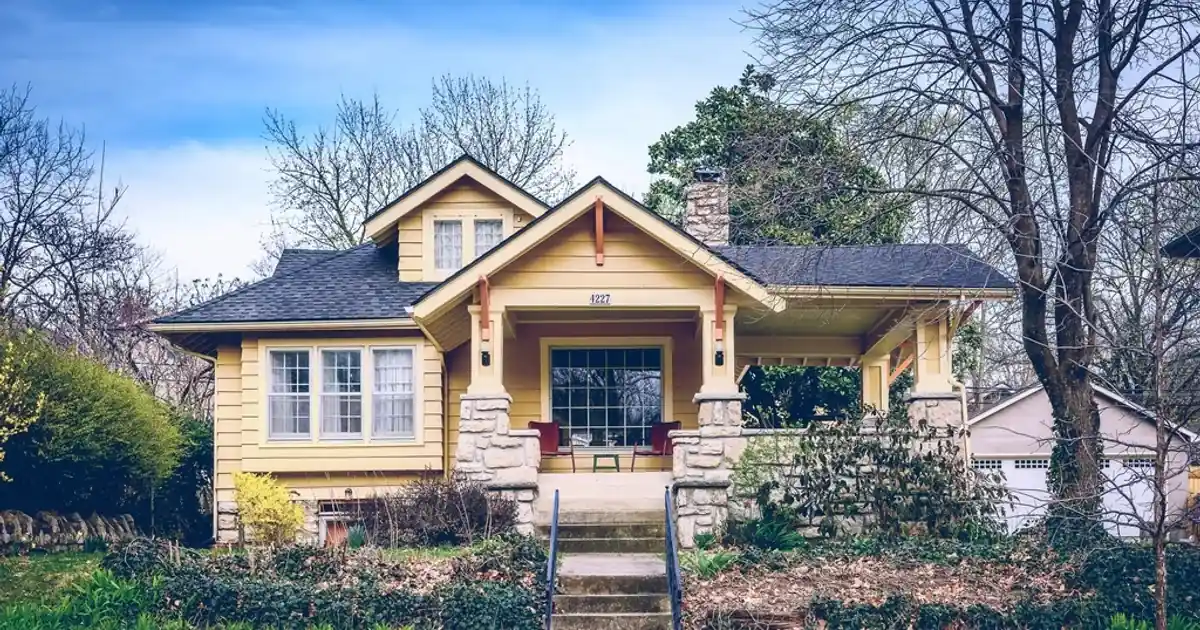 Two-storey family house with a porch and front garden
