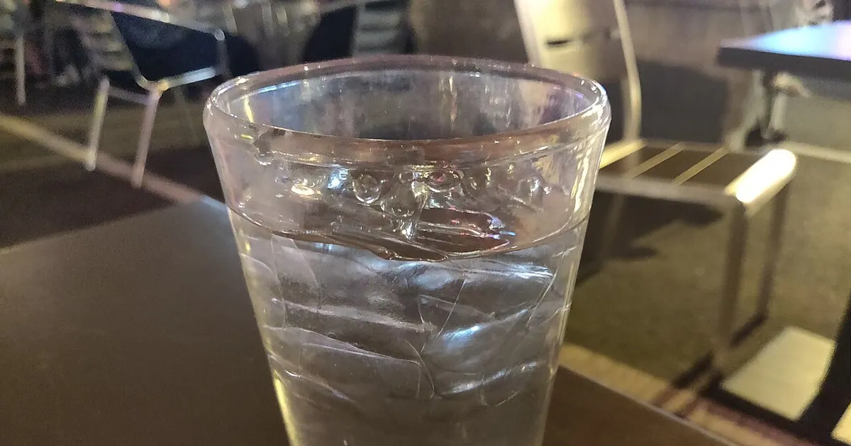 A clear glass of water on a table