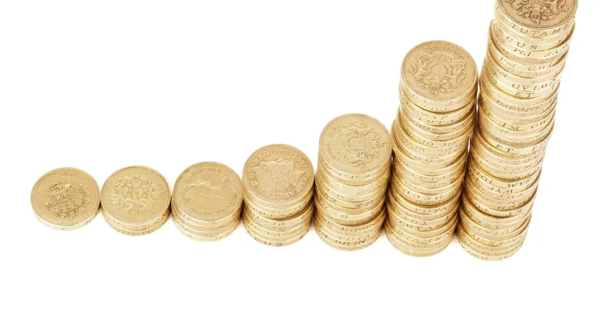 Stacks of coins rising in height from left to right