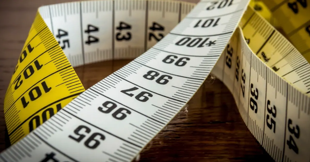 Close-up of a yellow tailor’s tape measure
