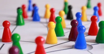 Colourful board game pieces on a board