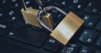 Padlock resting on a laptop keyboard